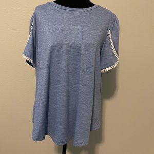 Beachy blue top with white detail on the sleeves.
